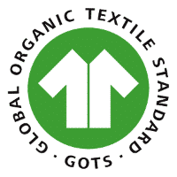 Logo du label GOTS avec une blouse de couleur blanche dans un cercle de couleur vert.